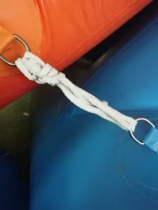 Fully installed inflatable water slide floating securely on open water