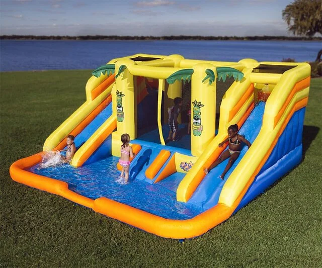 Large floating inflatable water park setup on a calm lake