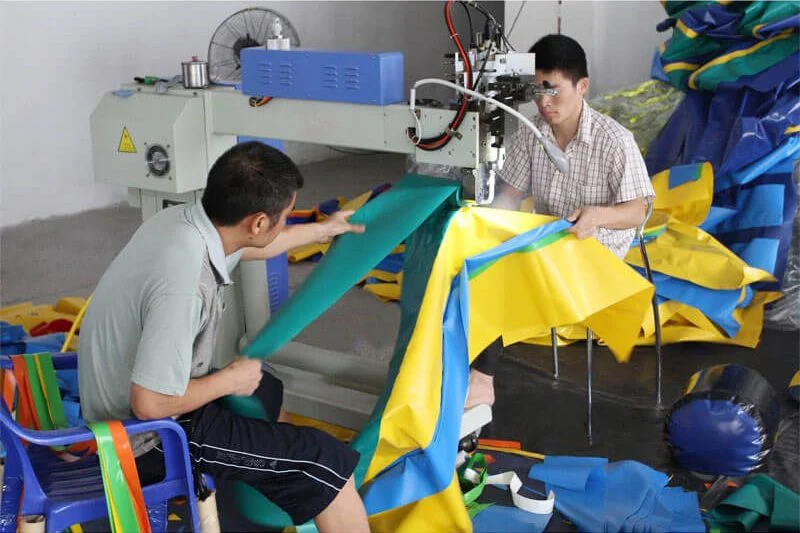 Inflatable water slide module showing reinforced PVC seam construction