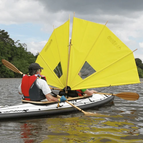 Compact deflated inflatable kayak packed into backpack storage