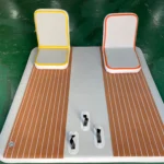 A white and brown inflatable mat with two chairs