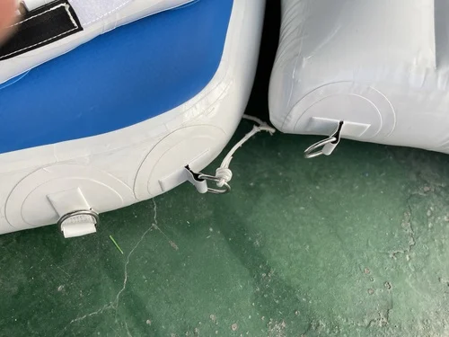 Inflatable dock installation detail showing D-ring attachment points