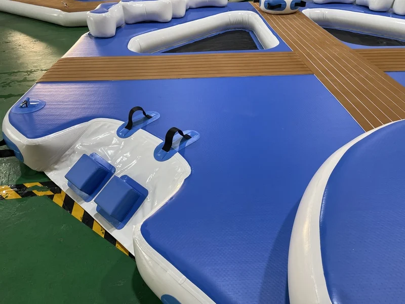 Assembly of a large modular inflatable dock on the water